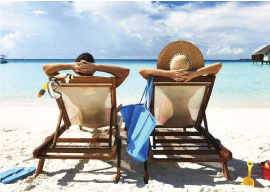 Couple on beach enjoying Holidays